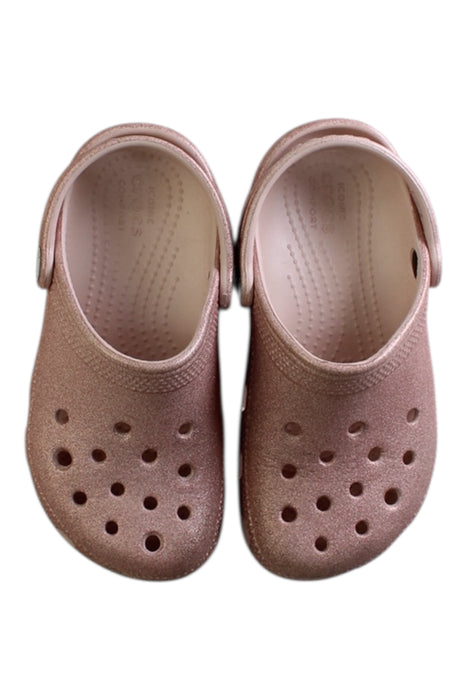 A Pink Slip Ons from Crocs in size 5T for girl. (Back View)