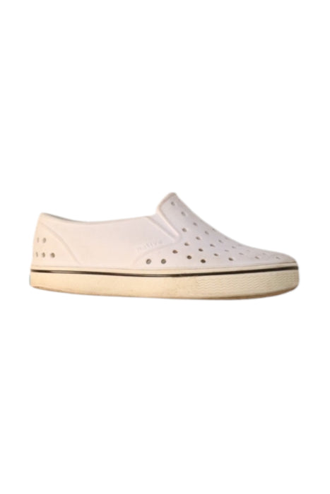 A White Slip Ons from Native Shoes in size 5T for neutral. (Front View)