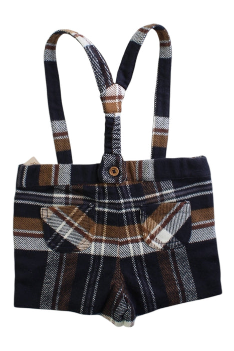 A Navy Overall Shorts from Nanos in size 6-12M for girl. (Back View)