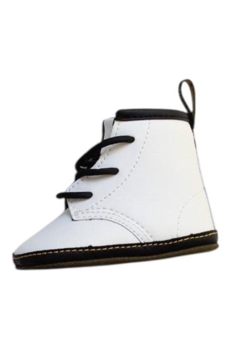 A White Booties from Dr. Martens in size 3-6M for neutral. (Front View)