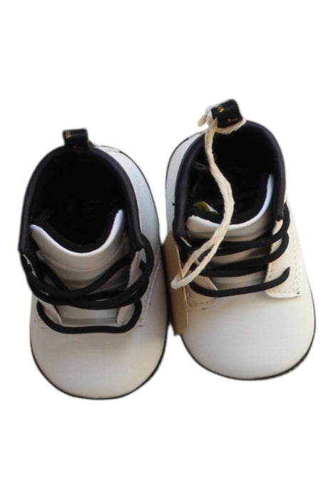 A White Booties from Dr. Martens in size 3-6M for neutral. (Back View)