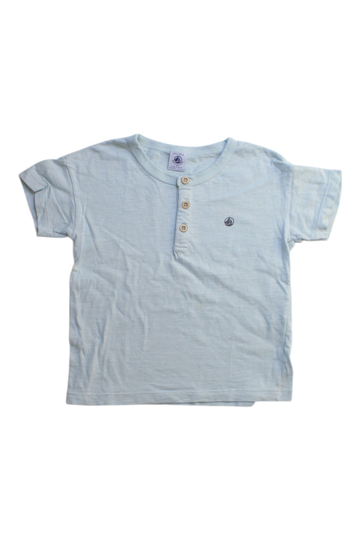 A Blue Short Sleeve T Shirts from Petit Bateau in size 6T for girl. (Front View)