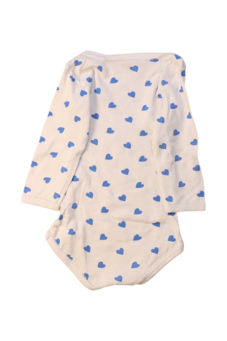A White Long Sleeve Bodysuits from Petit Bateau in size 6-12M for girl. (Back View)