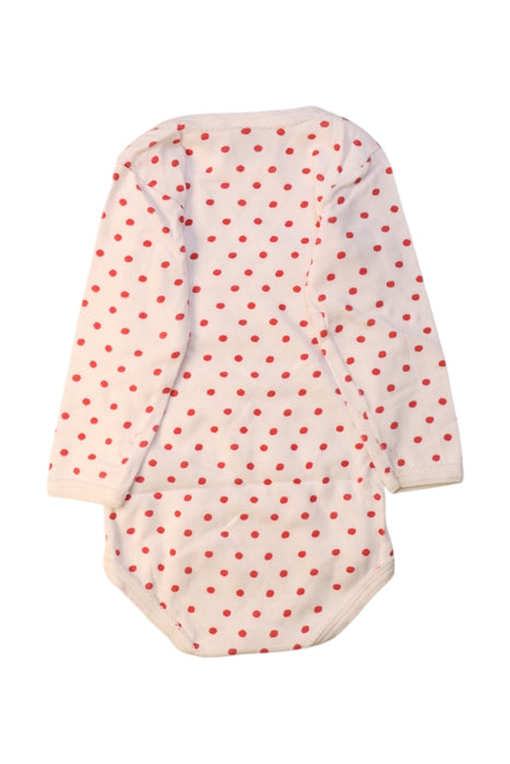 A White Long Sleeve Bodysuits from Petit Bateau in size 6-12M for girl. (Back View)