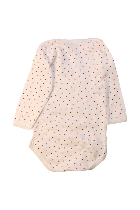 A White Long Sleeve Bodysuits from Petit Bateau in size 6-12M for girl. (Back View)