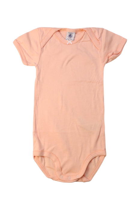 A Peach Short Sleeve Bodysuits from Petit Bateau in size 2T for girl. (Front View)