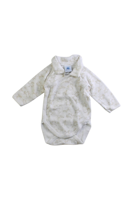 A White Long Sleeve Bodysuits from Petit Bateau in size Newborn for neutral. (Front View)