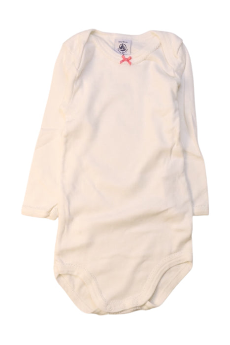 A White Long Sleeve Bodysuits from Petit Bateau in size 12-18M for girl. (Front View)