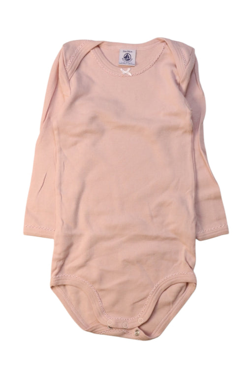 A Peach Long Sleeve Bodysuits from Petit Bateau in size 2T for girl. (Front View)
