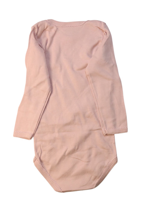 A Peach Long Sleeve Bodysuits from Petit Bateau in size 2T for girl. (Back View)