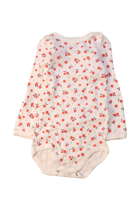 A White Long Sleeve Bodysuits from Petit Bateau in size 12-18M for girl. (Front View)