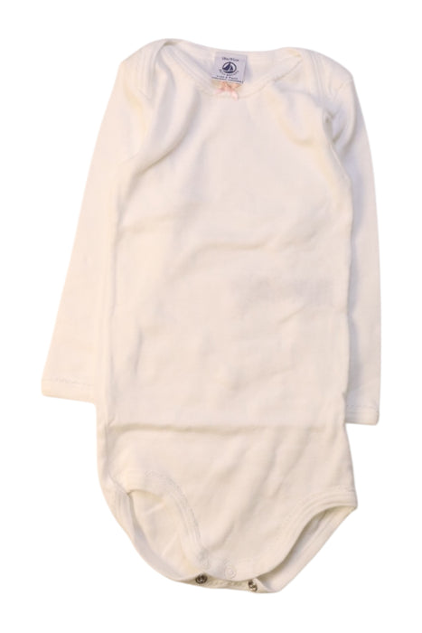 A White Long Sleeve Bodysuits from Petit Bateau in size 12-18M for girl. (Front View)