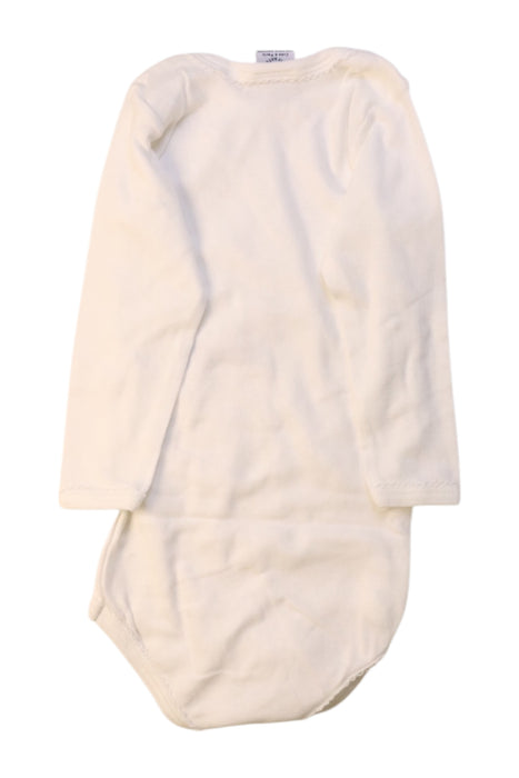 A White Long Sleeve Bodysuits from Petit Bateau in size 12-18M for girl. (Back View)