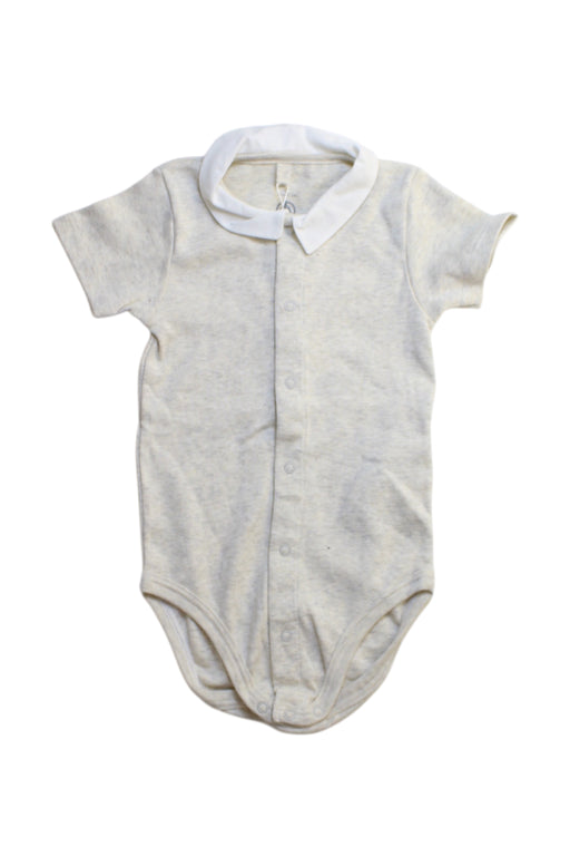 A White Short Sleeve Bodysuits from Petit Bateau in size 12-18M for girl. (Front View)