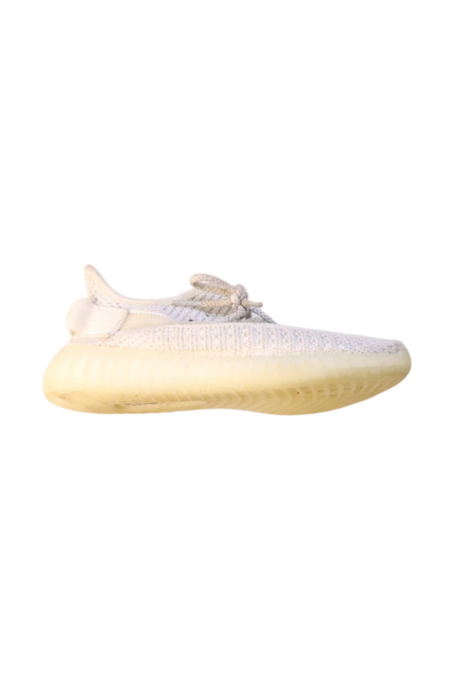 A Ivory Sneakers from Adidas Yeezy in size 11Y for boy. (Front View)