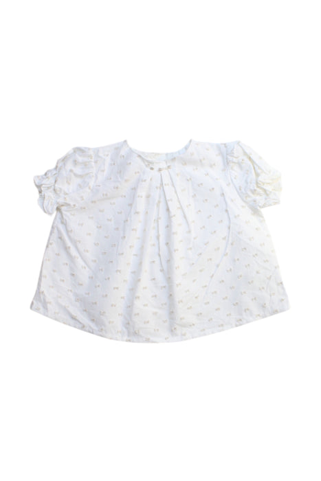 A White Short Sleeve Tops from Nanos in size 0-3M for girl. (Front View)