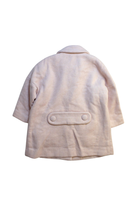 A Ivory Coats from Hucklebones in size 4T for girl. (Back View)