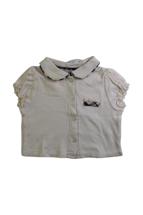 A Ivory Short Sleeve Tops from Chickeeduck in size 3-6M for girl. (Front View)