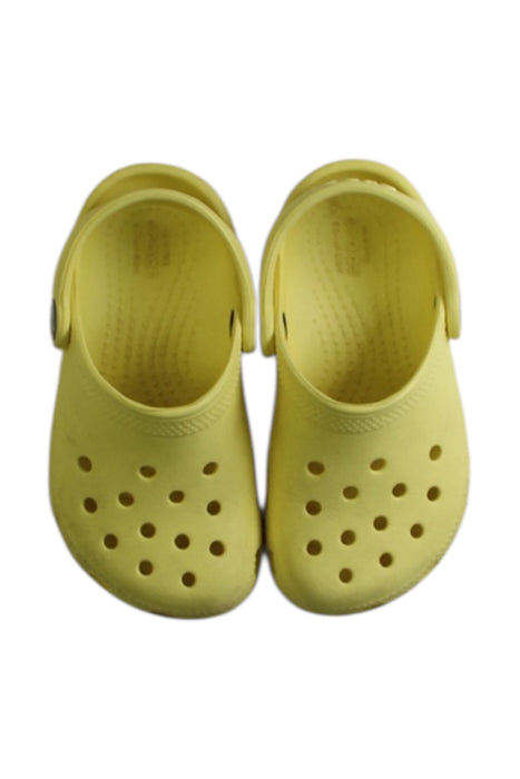 A Yellow Slip Ons from Crocs in size 3T for neutral. (Back View)