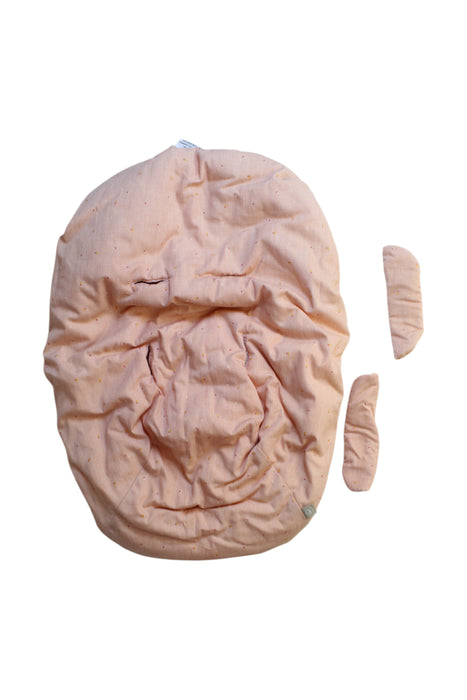 A Peach Changing Mats & Covers from Stokke in size Newborn for girl. (Front View)