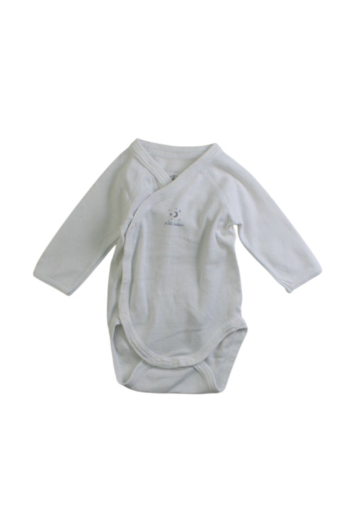 A White Long Sleeve Bodysuits from Petit Bateau in size Newborn for neutral. (Front View)
