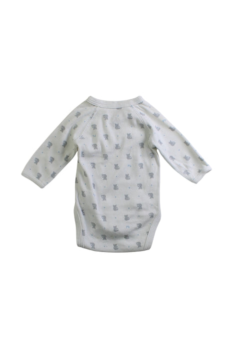 A White Long Sleeve Bodysuits from Petit Bateau in size Newborn for neutral. (Back View)