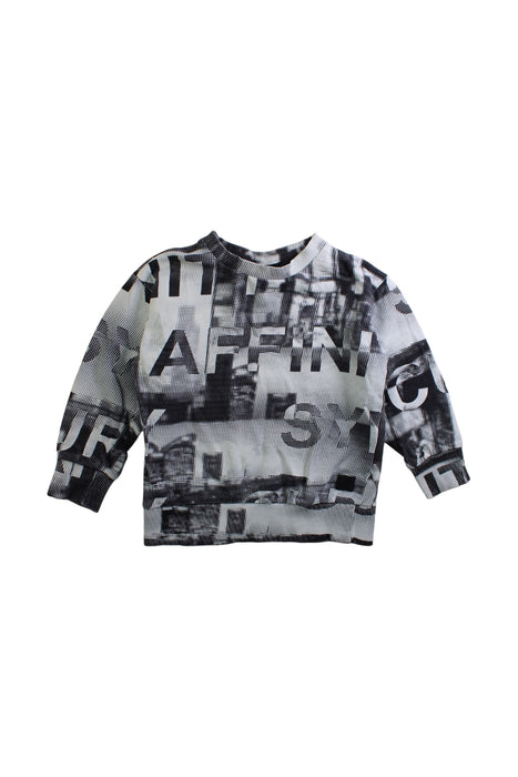 A Black Long Sleeve Tops from Molo in size 5T for boy. (Front View)