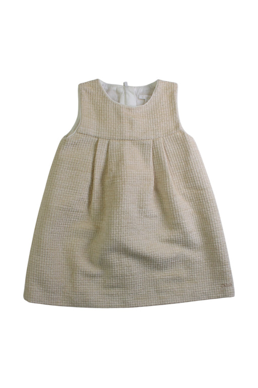 A Ivory Sleeveless Dresses from Chloe in size 6-12M for girl. (Front View)