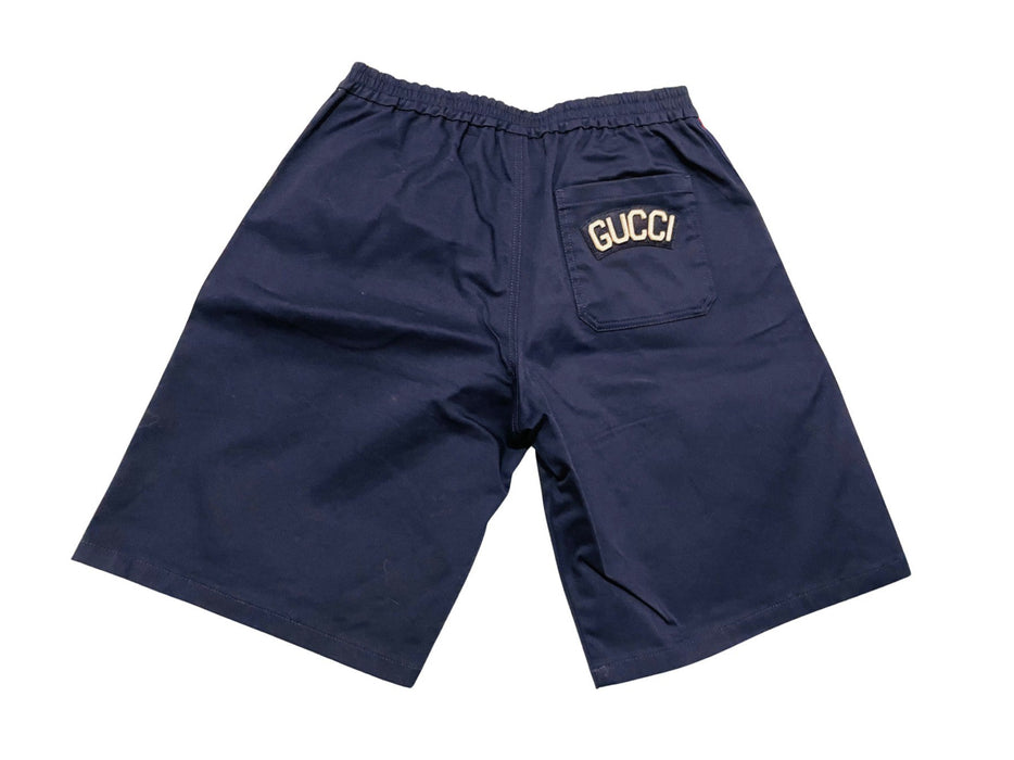 A Navy Shorts from Gucci in size 10Y for boy. (Back View)