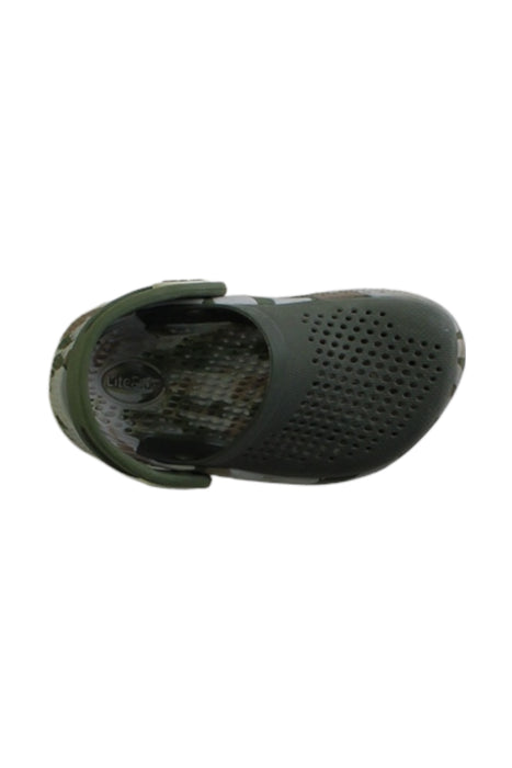 A Green Slip Ons from Crocs in size 18-24M for boy. (Front View)
