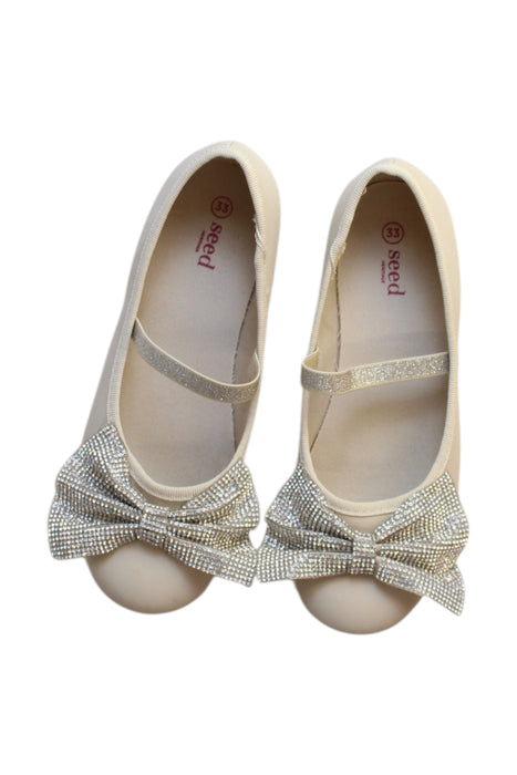 A Beige Flats from Seed in size 10Y for girl. (Back View)