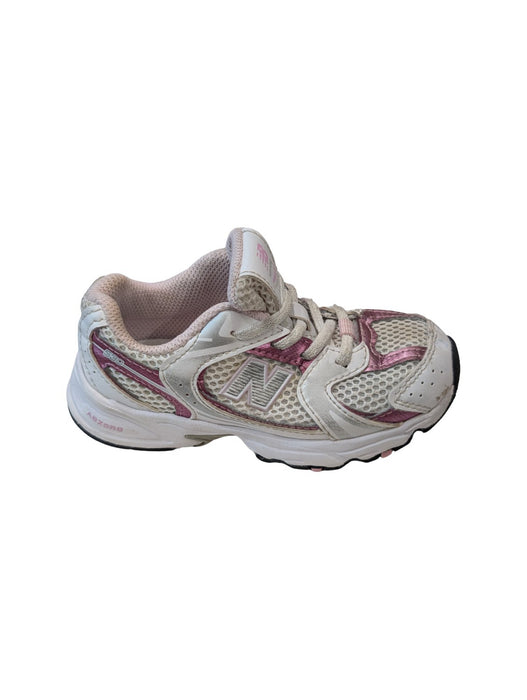 A White Sneakers from New Balance in size 4T for girl. (Front View)