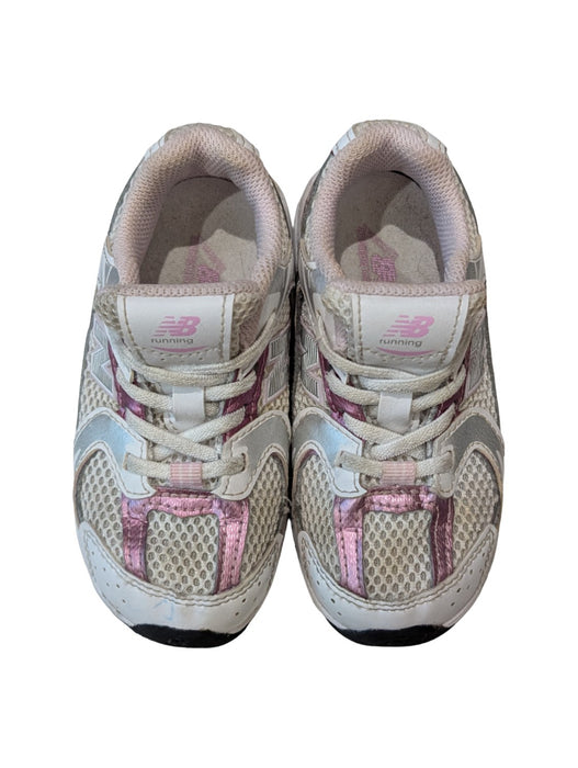 A White Sneakers from New Balance in size 4T for girl. (Back View)