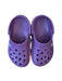 A Purple Slip Ons from Crocs in size 4T for girl. (Front View)