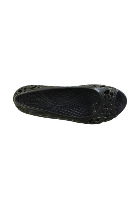 A Black Slip Ons from Crocs in size 10Y for girl. (Front View)