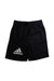 A Black Shorts from Adidas in size 5T for boy. (Front View)