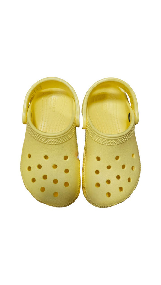 A Yellow Slip Ons from Crocs in size 3T for neutral. (Front View)