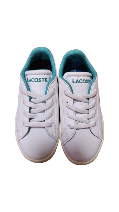 A White Sneakers from Lacoste in size 4T for neutral. (Front View)