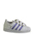 A White Sneakers from Adidas in size 5T for girl. (Front View)