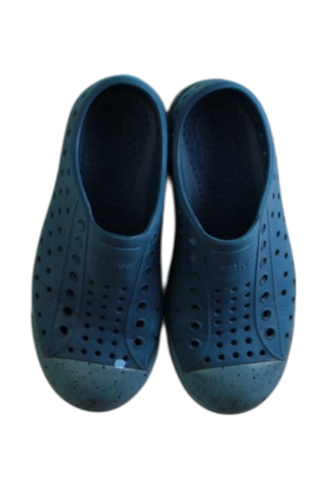 A Blue Slip Ons from Native Shoes in size 6T for boy. (Back View)