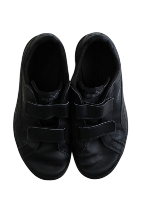 A Black Sneakers from Puma in size 10Y for boy. (Back View)