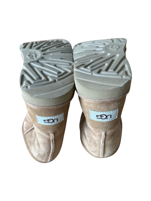 A Beige Winter Boots from UGG in size 7Y for neutral. (Back View)