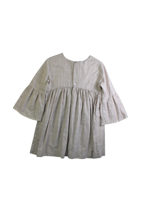 A Ivory Short Sleeve Dresses from Laranjinha in size 5T for girl. (Back View)