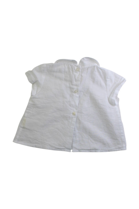 A White Sleeveless Tops from Nanos in size 3-6M for girl. (Back View)