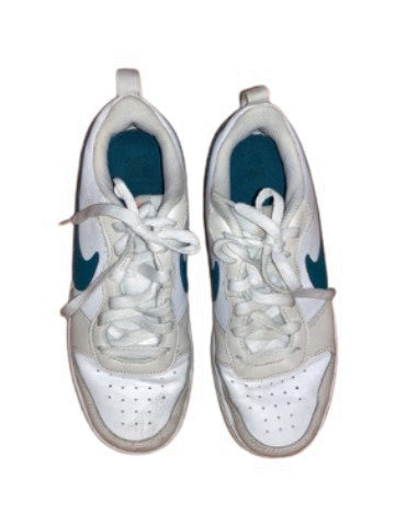 A White Sneakers from Nike in size 12Y for boy. (Front View)