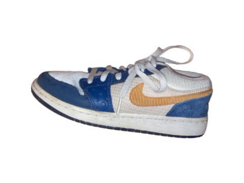 A White Sneakers from Nike in size 10Y for boy. (Back View)
