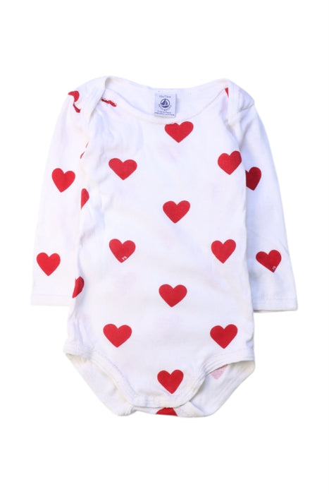 A White Long Sleeve Bodysuits from Petit Bateau in size 6-12M for girl. (Front View)