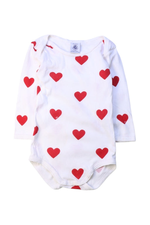 A White Long Sleeve Bodysuits from Petit Bateau in size 6-12M for girl. (Front View)