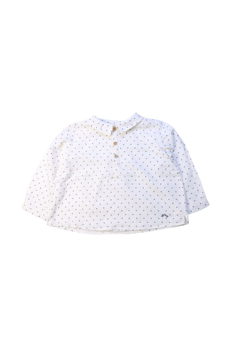 A White Long Sleeve Shirts from Nanos in size 12-18M for girl. (Front View)
