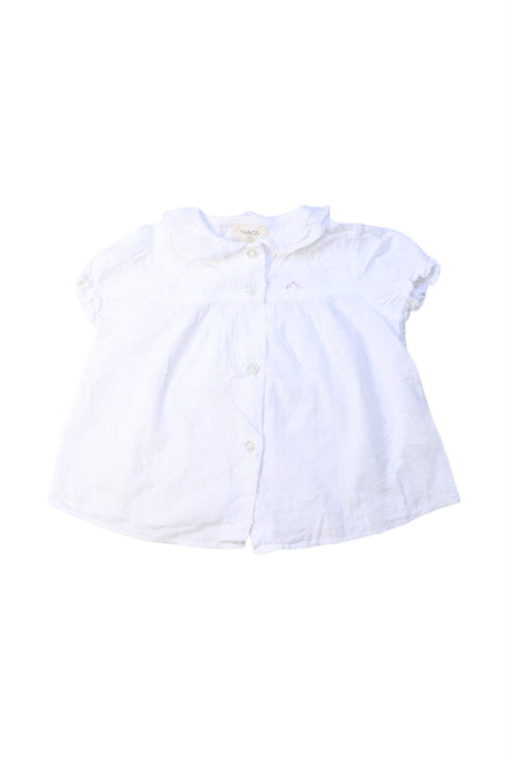 A White Short Sleeve Shirts from Nanos in size 12-18M for girl. (Front View)